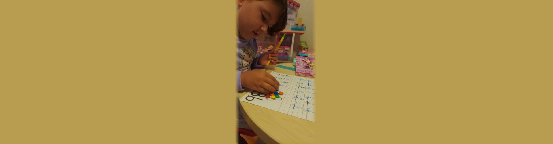 child holding a pencil